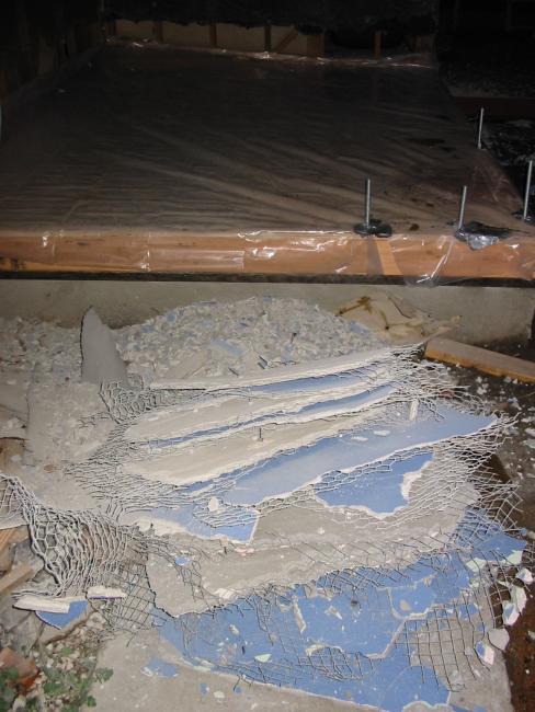 pile of removed stucco, wire